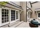 Exterior of home with deck, sliding glass doors, and outdoor cooking area at 241 Nacoochee Nw Dr, Atlanta, GA 30305