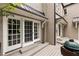 Exterior of home with deck, sliding glass doors, and outdoor cooking area at 241 Nacoochee Nw Dr, Atlanta, GA 30305