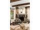 Living room fireplace with stone surround and decorative artwork at 241 Nacoochee Nw Dr, Atlanta, GA 30305