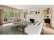 Bright living room featuring a fireplace, neutral tones, and views to the back yard at 241 Nacoochee Nw Dr, Atlanta, GA 30305