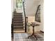 Elegant staircase with patterned carpet and decorative table at 241 Nacoochee Nw Dr, Atlanta, GA 30305