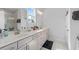 Bright bathroom with double vanity, stylish fixtures, and natural light from the window at 361 Watson Ave, Woodstock, GA 30189
