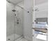 Walk-in shower showcasing elegant tiling and modern fixtures, connecting to a bedroom at 361 Watson Ave, Woodstock, GA 30189