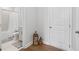Bathroom with bathtub and shower combo, white fixtures, and neutral decor at 361 Watson Ave, Woodstock, GA 30189