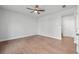 Spacious bedroom with hardwood floors, ceiling fan and a white door at 361 Watson Ave, Woodstock, GA 30189