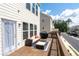 Outdoor deck with seating, grill, and view of the street at 361 Watson Ave, Woodstock, GA 30189