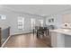 Bright dining area with hardwood floors, modern lighting, and elegant furniture at 361 Watson Ave, Woodstock, GA 30189
