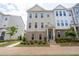 Charming townhouse featuring a brick facade, inviting entrance, and meticulously manicured landscaping at 361 Watson Ave, Woodstock, GA 30189