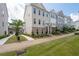 Attractive townhomes with manicured lawns and brick sidewalks in a well-maintained community at 361 Watson Ave, Woodstock, GA 30189