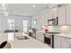 Well-equipped kitchen featuring stainless steel appliances, quartz countertops, and ample cabinet space at 361 Watson Ave, Woodstock, GA 30189