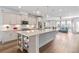 Bright kitchen with a large island, stainless steel appliances, and open concept to the living area at 361 Watson Ave, Woodstock, GA 30189