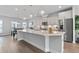 Modern kitchen boasts sleek stainless steel appliances, a large island, and bright, open layout at 361 Watson Ave, Woodstock, GA 30189