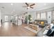 Open concept living room and kitchen with stainless steel appliances and modern finishes at 361 Watson Ave, Woodstock, GA 30189