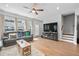 Bright living room featuring hardwood floors, lots of natural light, and a comfortable sofa at 361 Watson Ave, Woodstock, GA 30189