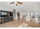 Spacious living room with hardwood floors, staircase, and modern entertainment center at 361 Watson Ave, Woodstock, GA 30189