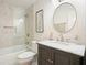 Bathroom featuring a marble vanity, and shower/tub combination at 11940 Mountain Laurel Dr, Roswell, GA 30075