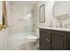 Cozy bathroom featuring a shower over tub with stylish marble herringbone tile and a dark vanity at 11940 Mountain Laurel Dr, Roswell, GA 30075