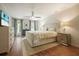Bright bedroom features hardwood floors, neutral tones, and stylish furnishings at 11940 Mountain Laurel Dr, Roswell, GA 30075