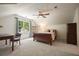 Bedroom features a dark wood bedframe, vaulted ceilings, and an adjacent study at 11940 Mountain Laurel Dr, Roswell, GA 30075