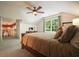 Bright bedroom with a vaulted ceiling and adjoining loft space at 11940 Mountain Laurel Dr, Roswell, GA 30075