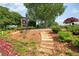 Stone steps leading to the Buckhead Country Club sign amid landscaped grounds at 11940 Mountain Laurel Dr, Roswell, GA 30075