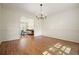Formal dining room featuring hardwood floors and classic wainscoting at 11940 Mountain Laurel Dr, Roswell, GA 30075