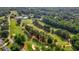 Scenic aerial view of a lush green golf course with mature trees and well-kept grounds at 11940 Mountain Laurel Dr, Roswell, GA 30075