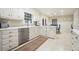 Updated eat-in kitchen with stainless appliances and white cabinets at 11940 Mountain Laurel Dr, Roswell, GA 30075