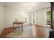 Office with hardwood floors, lots of natural light and neutral paint at 11940 Mountain Laurel Dr, Roswell, GA 30075