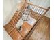 Grand staircase featuring hardwood steps, iron railings, and modern chandelier at 11940 Mountain Laurel Dr, Roswell, GA 30075
