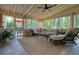 Inviting sunroom with wicker furniture, a ceiling fan, and lots of natural light at 11940 Mountain Laurel Dr, Roswell, GA 30075