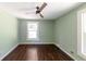 Bedroom with hardwood floors, neutral paint, and a window providing ample natural light at 3220 Memorial Dr, Decatur, GA 30032