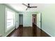 Bedroom with hardwood floors, a ceiling fan and a closet for storage at 3220 Memorial Dr, Decatur, GA 30032
