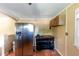 Kitchen featuring stainless steel refrigerator, terracotta flooring, and wooden cabinetry at 3220 Memorial Dr, Decatur, GA 30032