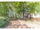 Large backyard with a wooden deck and privacy fence, perfect for Gathering gatherings and outdoor relaxation at 3830 Gallant Fox Ct, Duluth, GA 30096