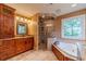 Bathroom with custom cabinets, granite countertops, shower, and jacuzzi at 3830 Gallant Fox Ct, Duluth, GA 30096