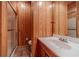 Bathroom with tiled floor, a shower, and wood paneled walls at 3830 Gallant Fox Ct, Duluth, GA 30096