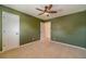 Bedroom features carpet floor, two doors and ceiling fan at 3830 Gallant Fox Ct, Duluth, GA 30096