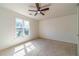 Bright bedroom featuring neutral carpet and a large window at 3830 Gallant Fox Ct, Duluth, GA 30096