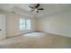 Bright bedroom with large window and tray ceiling at 3830 Gallant Fox Ct, Duluth, GA 30096