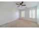 Bedroom features carpet floor, two windows and ceiling fan at 3830 Gallant Fox Ct, Duluth, GA 30096