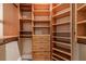 Walk in closet featuring multiple shelves and drawers at 3830 Gallant Fox Ct, Duluth, GA 30096