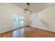 Bright dining room showcasing hardwood floors, paneled walls and view to the exterior at 3830 Gallant Fox Ct, Duluth, GA 30096