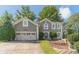 Charming two-story home featuring a well-manicured lawn, two-car garage, and a welcoming front entrance at 3830 Gallant Fox Ct, Duluth, GA 30096