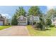 Charming two-story home featuring a well-manicured lawn, two-car garage, and a welcoming front entrance at 3830 Gallant Fox Ct, Duluth, GA 30096
