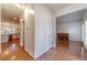 Spacious foyer with hardwood floors leading to the kitchen and living areas, showcasing the home's open layout at 3830 Gallant Fox Ct, Duluth, GA 30096
