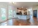 Bright kitchen with granite counters, stainless steel appliances, and hardwood floors at 3830 Gallant Fox Ct, Duluth, GA 30096