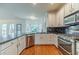 Well-appointed kitchen featuring stainless steel appliances, granite countertops, and a functional layout at 3830 Gallant Fox Ct, Duluth, GA 30096