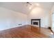 Large living room with fireplace, hardwood floors and vaulted ceiling at 3830 Gallant Fox Ct, Duluth, GA 30096