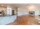 Spacious living room showcasing fireplace, seamless flow to kitchen and an abundance of natural light at 3830 Gallant Fox Ct, Duluth, GA 30096